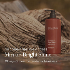Essentials by LOMA Max Shine Shampoo 12 oz pump bottle displayed against light hair with silicone-free, weightless, mirror-bright shine messaging