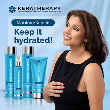 Woman standing beside Keratherapy Moisture+Keratin haircare products, including shampoo, conditioner, leave-in conditioner, and deep conditioning masque