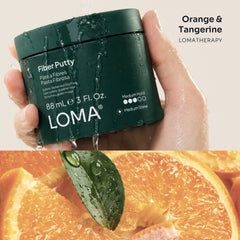 Wet Loma Fiber Putty jar with orange and tangerine aromatherapy imagery