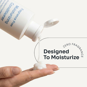 Loma Fragrance Free Moisturizing Conditioner being dispensed onto a hand, labeled zero fragrance and designed to moisturize
