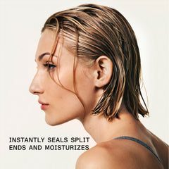 Model with wet, highlighted hair demonstrating OLAPLEX Moisturize and Mend Leave-In Conditioner benefits for sealing split ends and moisturizing hair