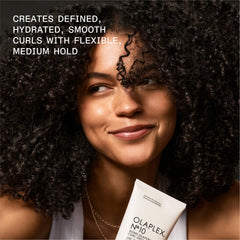 Model with defined, hydrated, smooth curls beside OLAPLEX Nº.10 Bond Shaper Curl Defining Gel and text describing flexible medium hold