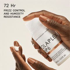 OLAPLEX Nº.6 Bond Smoother 3.3 oz cream being dispensed, with claims of 72-hour frizz control and humidity resistance
