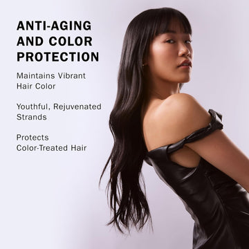 Model with long straight dark hair demonstrating the anti-aging and color protection benefits of TRUSS Miracle Conditioner.