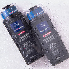TRUSS Professional Frizz Zero Shampoo and Conditioner bottles covered with water droplets