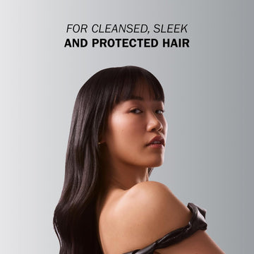 Model with long sleek dark hair and straight bangs demonstrating a smooth and protected result
