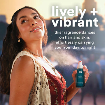 Woman holding Verb Amber and Jasmine Hair and Body Fragrance Mist while fragrance mist is sprayed around her