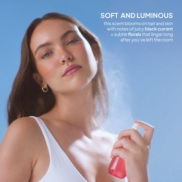 Woman spraying Verb Black Currant and Floral Hair and Body Fragrance Mist with black currant and floral scent notes