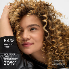 Curly-haired model with claims of 84% reduced frizz and 20% increased curl retention using the Verb Curl Collection