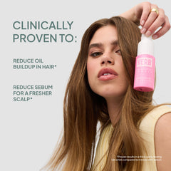 Model holding Verb Dry Shampoo Powder 2 oz with claims of reducing oil buildup and sebum for a fresher scalp