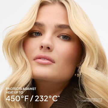 Blonde-haired model beside a claim that Verb Ghost Primer protects hair against heat up to 450 degrees Fahrenheit