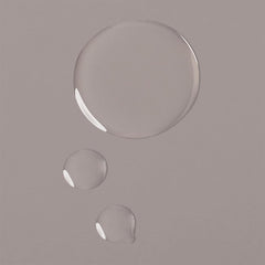 Clear oil texture of Verb Moringa + Jojoba Treatment Oil shown in three droplets