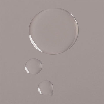 Clear oil texture of Verb Moringa + Jojoba Treatment Oil shown in three droplets